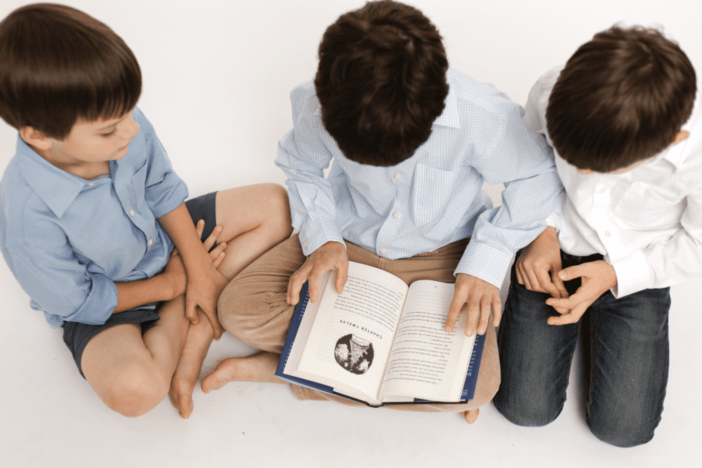 Image of kids reading a book